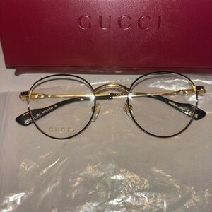Gucci Elegant Gold and Black Eyewear